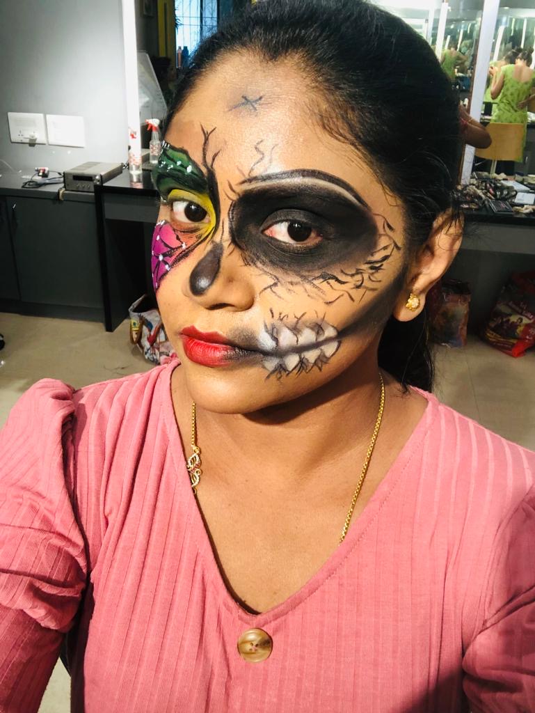 Half skull face art makeup with colourful design